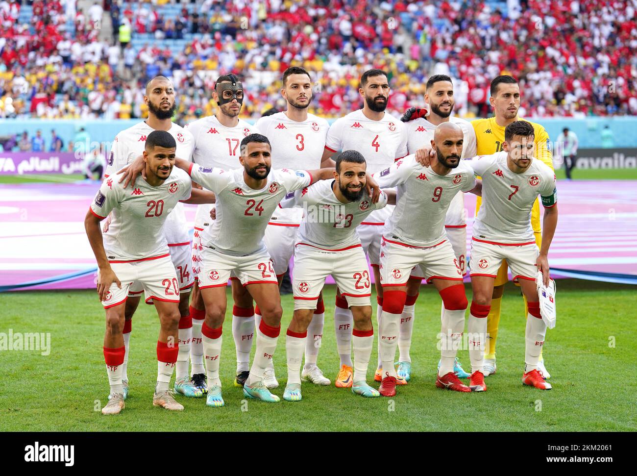 Tunisia's Aissa Laidouni, Ellyes Skhiri, Montassar Talbi, Yassine Meriah, Dylan Bronn, Aymen Dahmen, Mohamed Drager, Ali Abdi, Naim Sliti, Issam Jebali and Youssef Msakni line up on the pitch for a team photo ahead of the FIFA World Cup Group D match at the Al Janoub Stadium in Al-Wakrah, Qatar. Picture date: Saturday November 26, 2022. Stock Photo