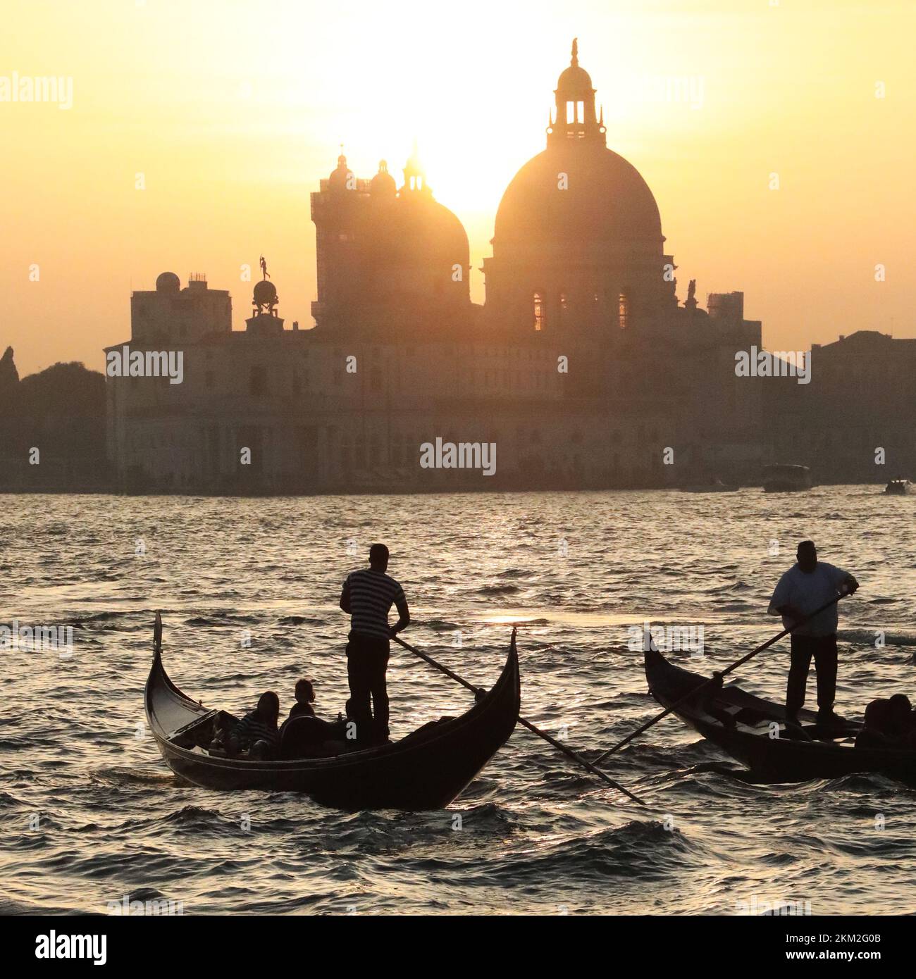 Gondoliers in backlit at Venice, square composition Stock Photo