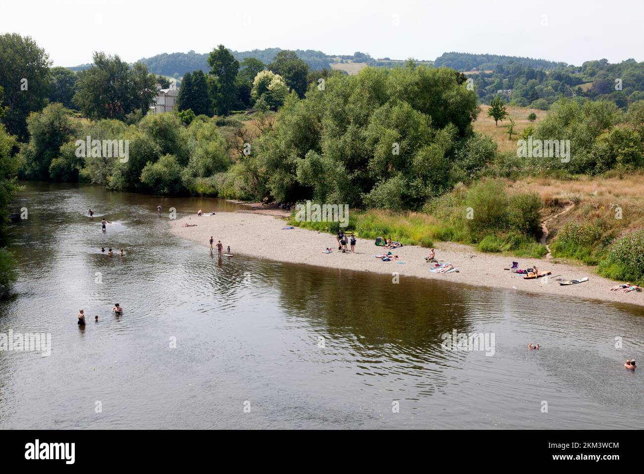 People enjoying the outdoors beside the River Wye on the hottest day on record, 19 July 2022, Bredwardine, Herefordshire Stock Photo
