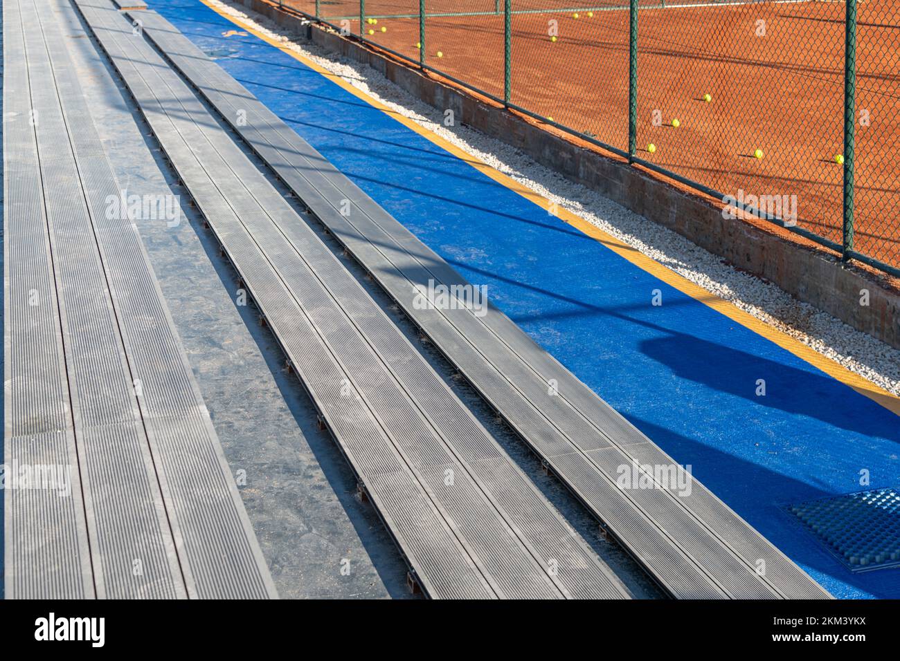 Seating area for spectators made with composite deck next to the tennis