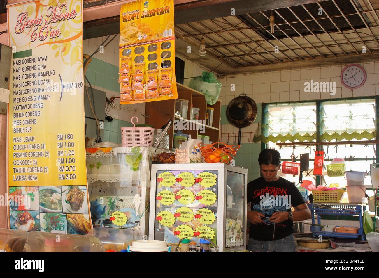 Ipoh, Perak, Malaysia - November 2012: A street stall serving a variety of Indonesian dishes in a food court in the town of Ipoh. Stock Photo