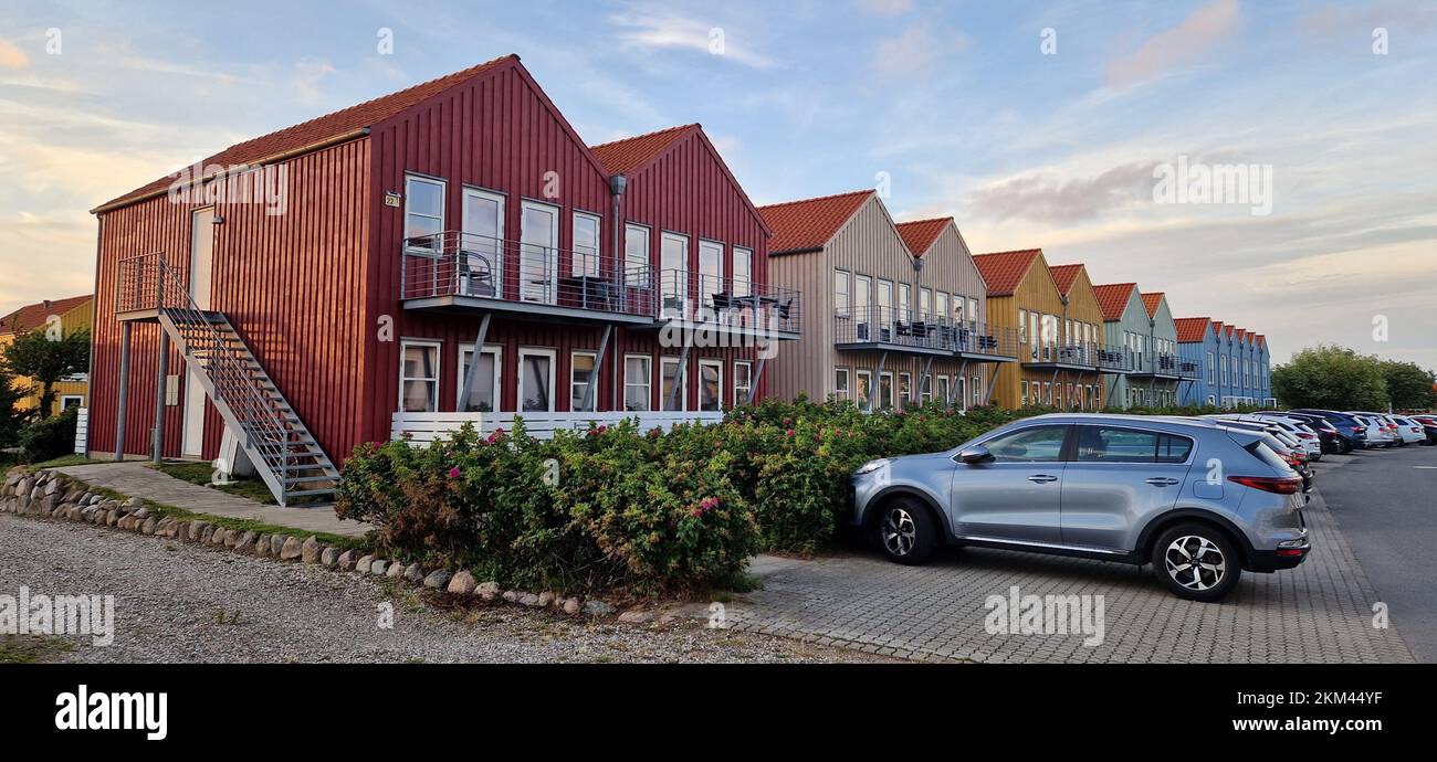The colorful beach vacation houses on a row on the Langeland island in