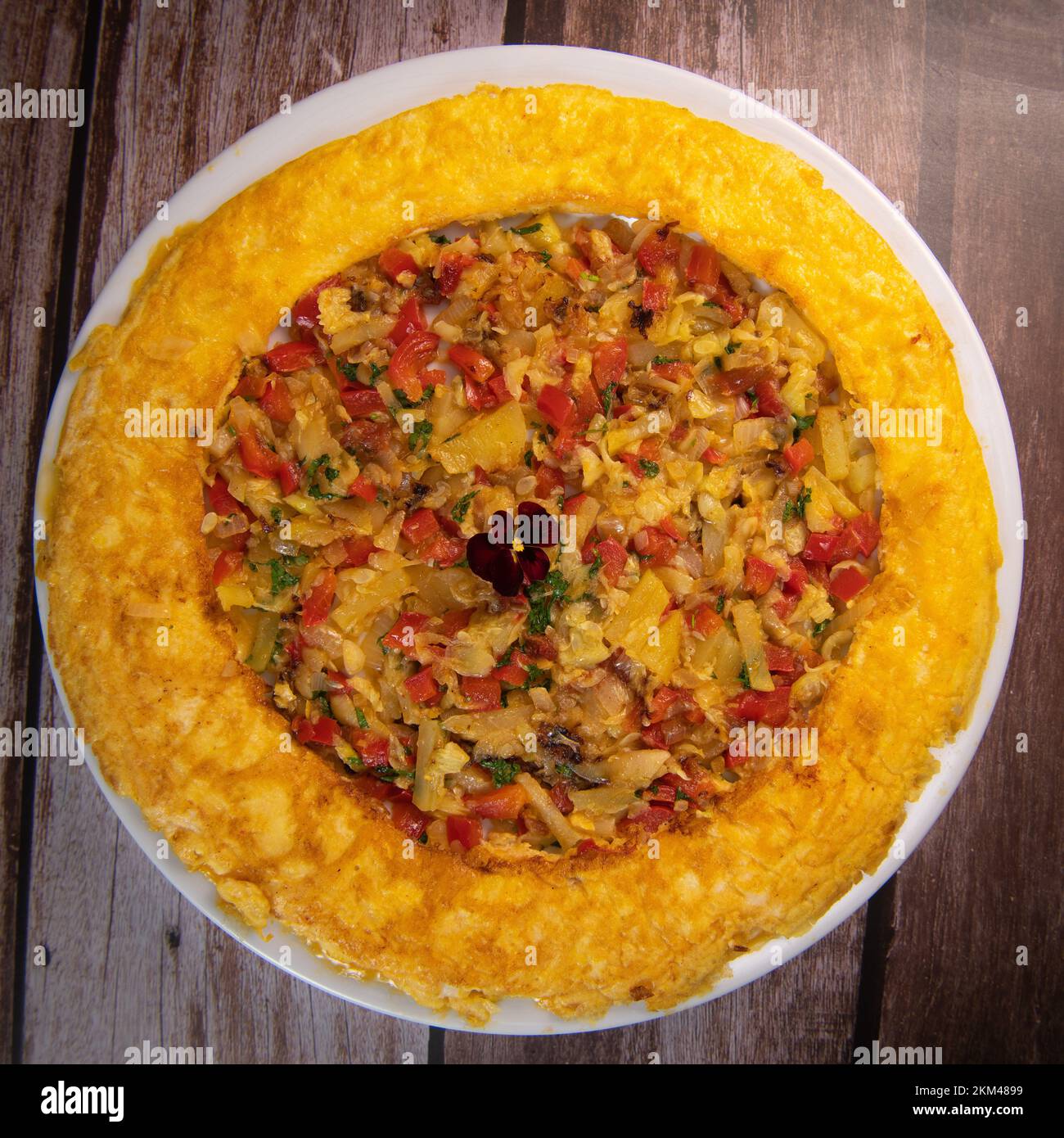 Recipe Omelette with peppers, onions, tomatoes, courgettes and