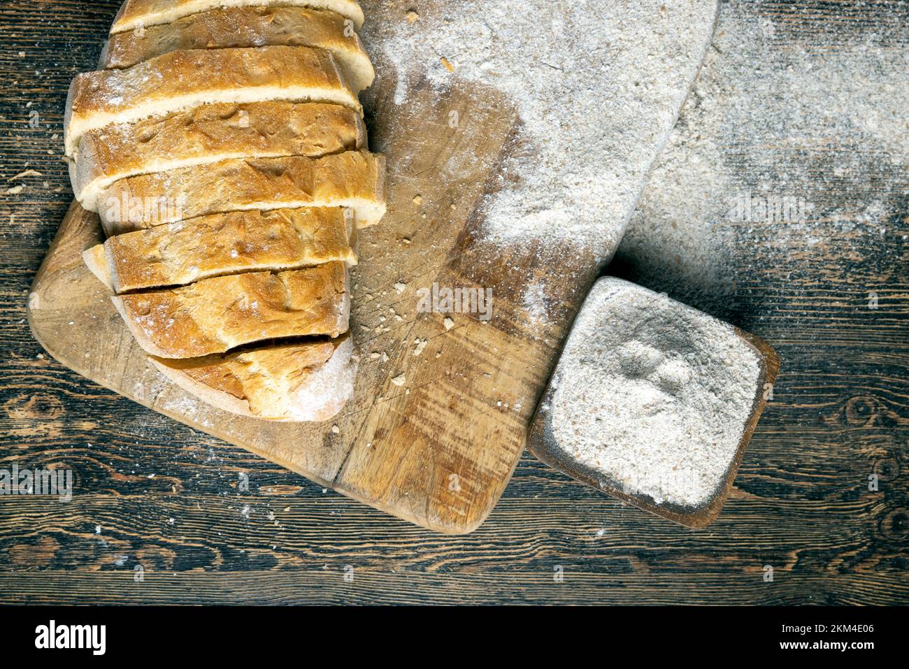 cut fresh bread into pieces while cooking with bread, the bread is cut