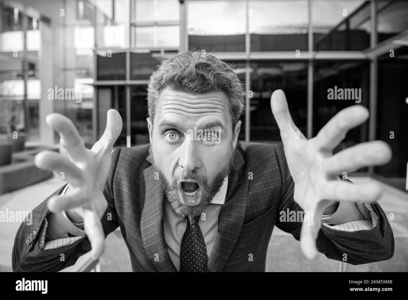 angry mature business man in formalwear shouting and gesturing, stress Stock Photo