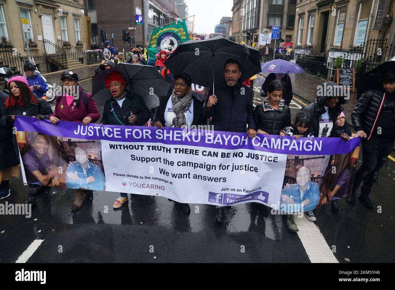 The sister of Sheku Bayoh, Kadi Johnston (centre) and Human rights lawyer Aamer Anwar (centre right) during a anti-racism and anti-fascist march in Glasgow, organised by the Scottish Trade Unions Congress (STUC), as part of the annual St Andrew's Day march and rally. Picture date: Saturday November 26, 2022. Stock Photo
