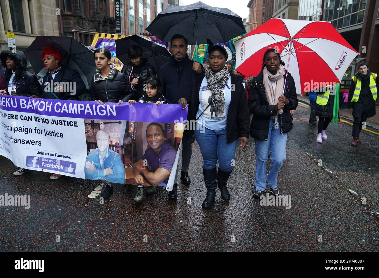 The sister of Sheku Bayoh, Kadi Johnston (second right) and Human rights lawyer Aamer Anwar (centre) during a anti-racism and anti-fascist march in Glasgow, organised by the Scottish Trade Unions Congress (STUC), as part of the annual St Andrew's Day march and rally. Picture date: Saturday November 26, 2022. Stock Photo