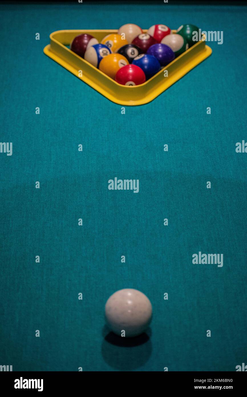 View of Ballard's balls with a cue ball and green Baize-covered table. Stock Photo