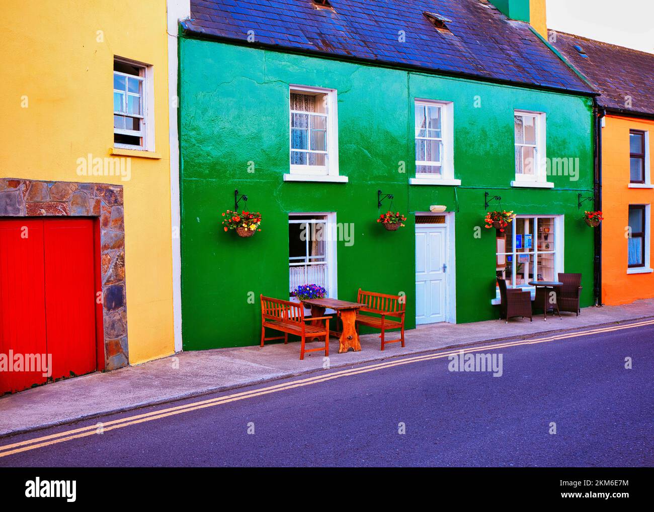 Vibrant brightly coloured houses in the village of Eyeries, Beara Peninsula, County Cork, Ireland Stock Photo