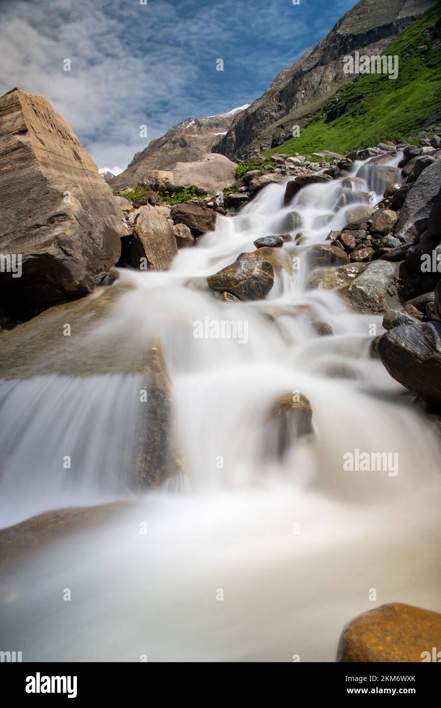 A vertical long exposure shot of a rocky cascading waterfall Stock ...