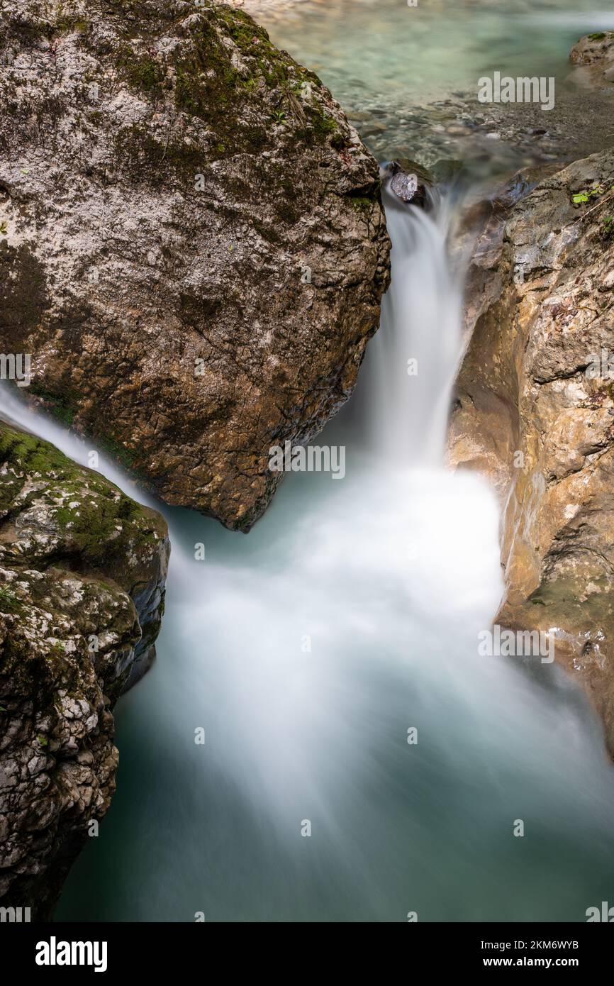 A vertical long exposure shot of a rocky cascading waterfall Stock ...