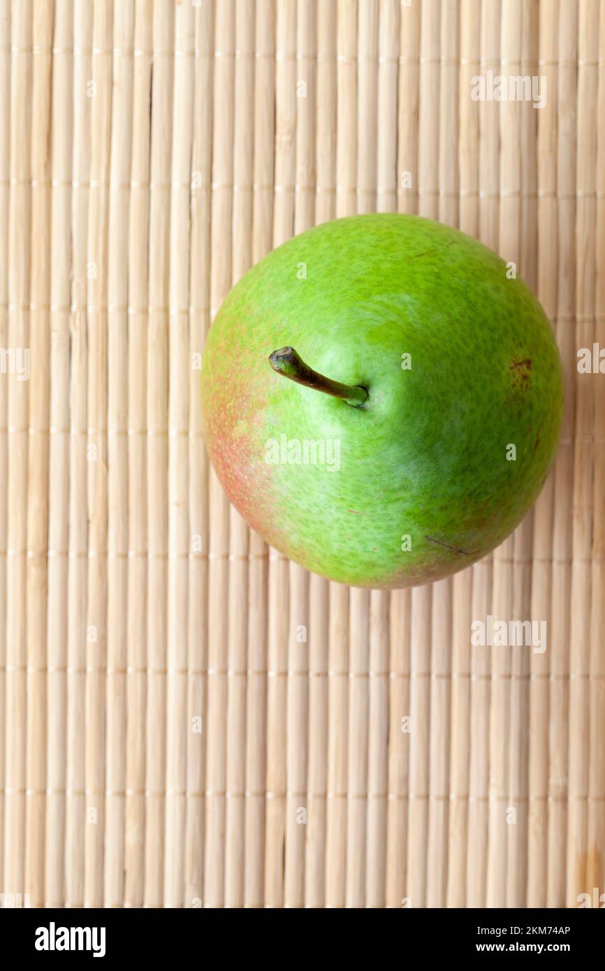 A Ripe Paer a whole ripe pear while cooking, juicy and ripe pear in the kitchen ...