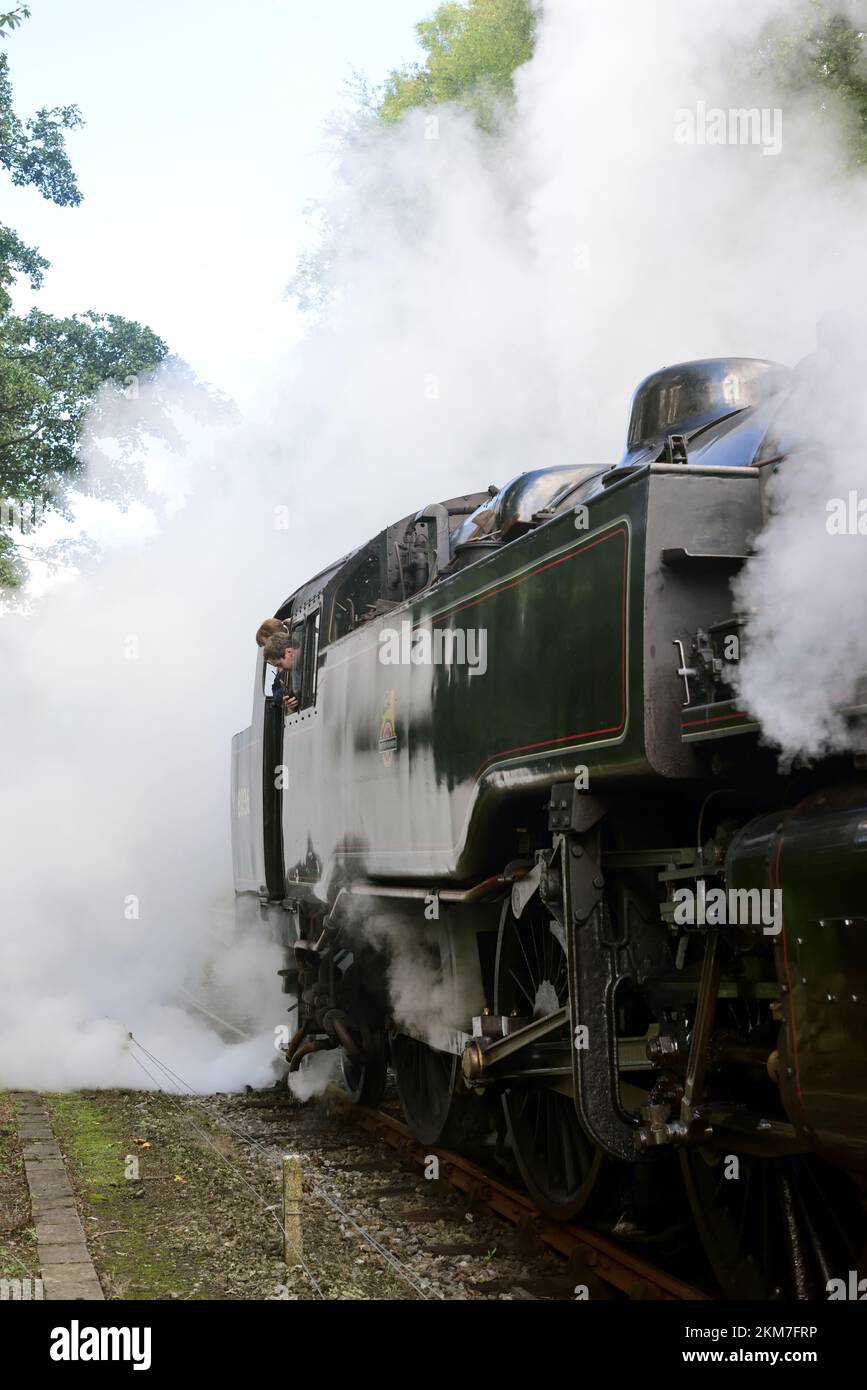 Steam escaping from BR Standard class 4 tank locomotive No 80136 at Goathland, as the crew look on. Stock Photo