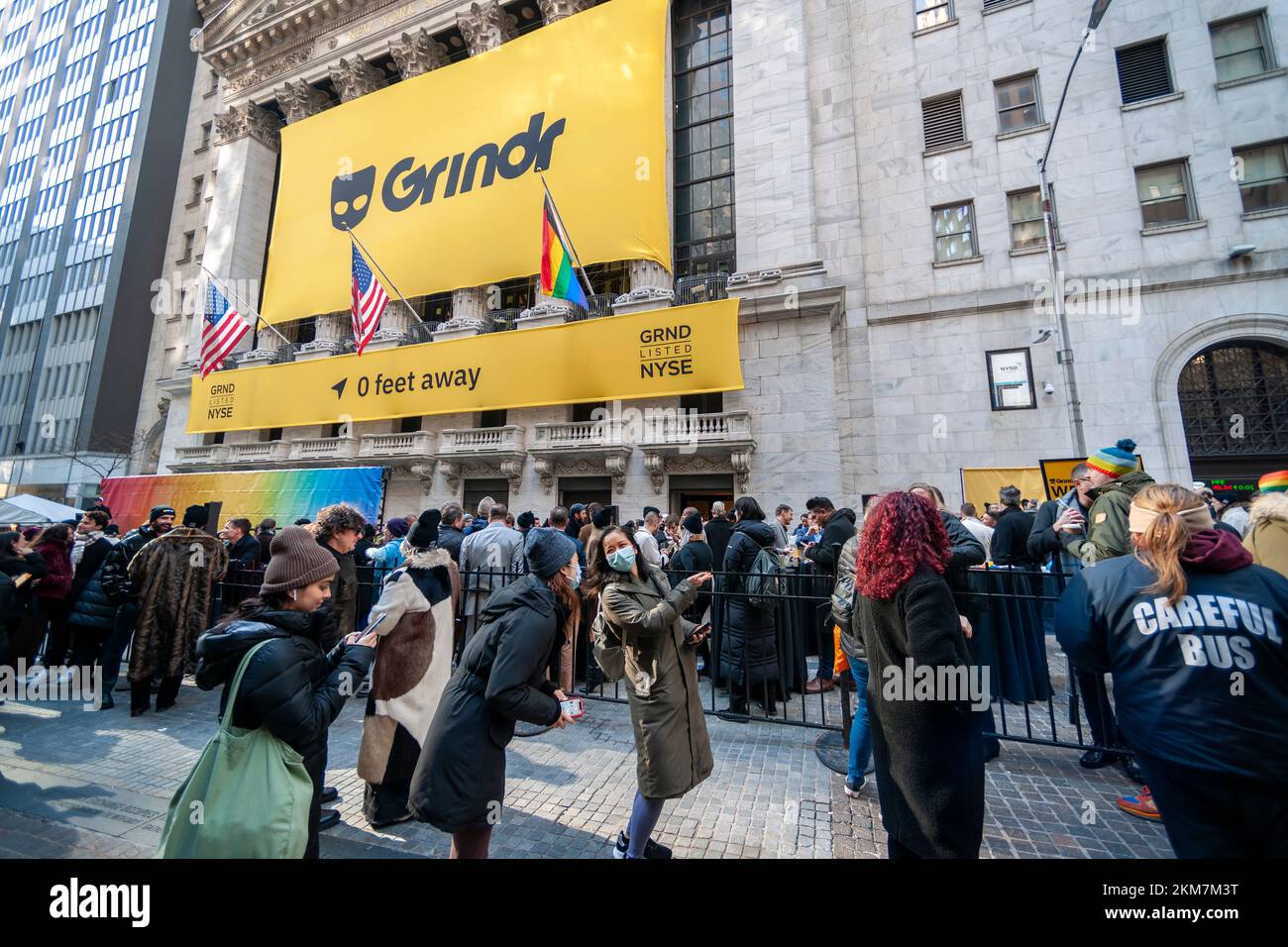 A banner on the facade looms over the hoopla in front of the New York Stock Exchange celebrating the SPAC of the Gay dating app Grindr in New York on Friday, November 18, 2022. Grindr will be listed on the exchange as GRND. (© Richard B. Levine) Stock Photo