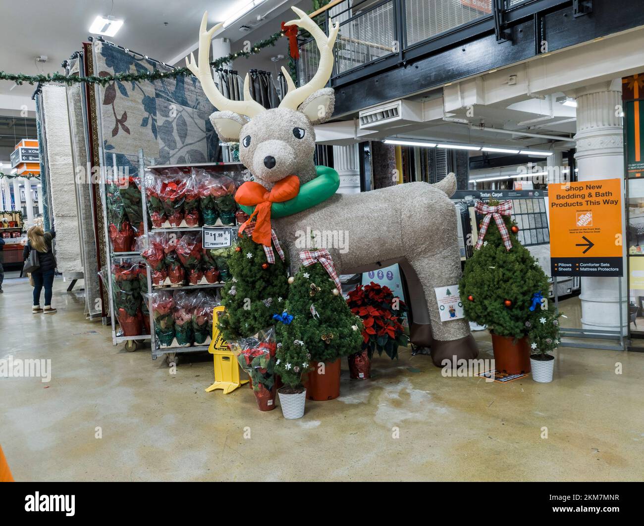 A giant reindeer Christmas display greets, or scares, visitors entering in a Home Depot store in Chelsea in New York on Saturday, November, 19, 2022. Only 36 more shopping days until Christmas. (© Richard B. Levine) Stock Photo