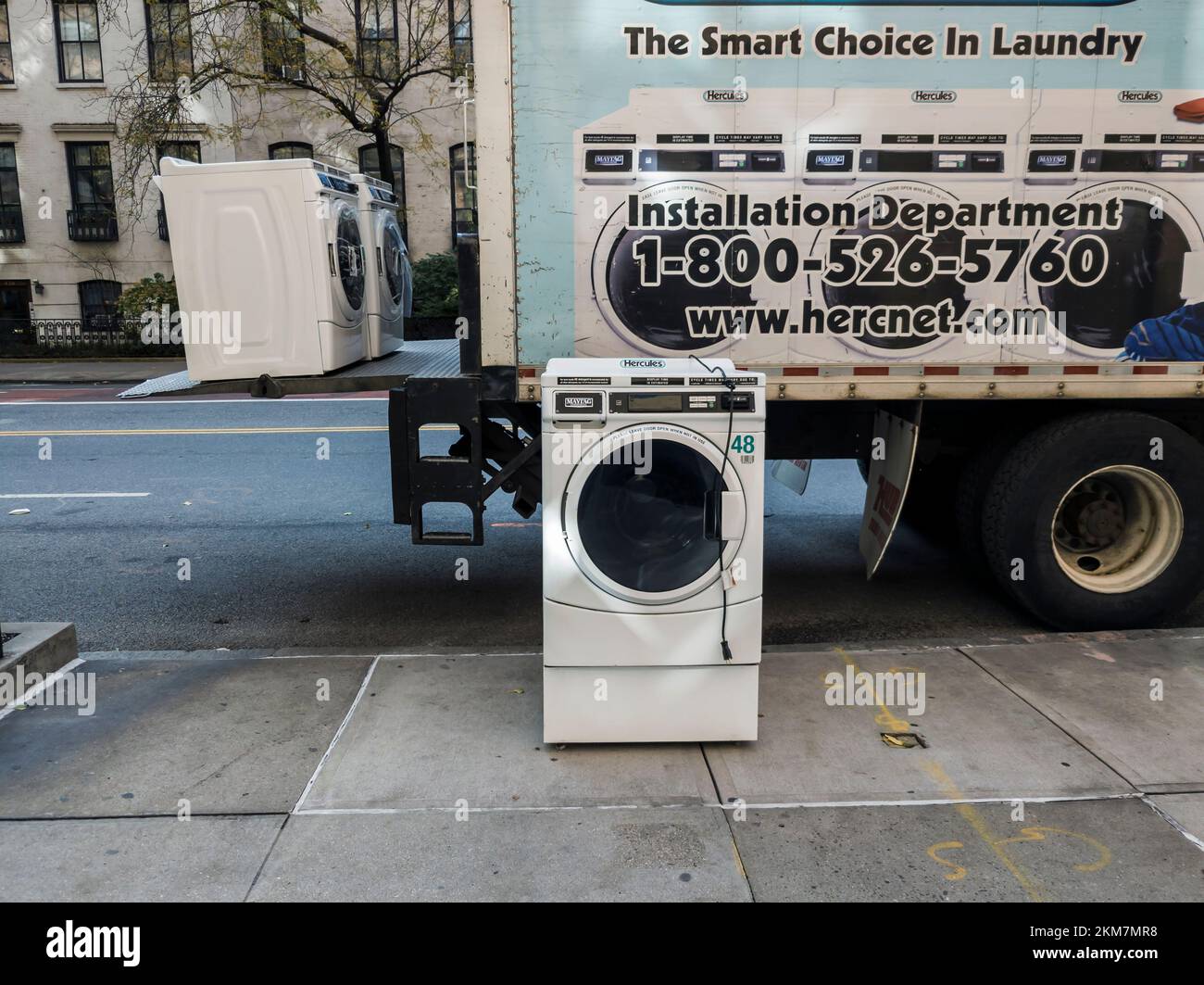 A delivery of Maytag brand washing machines to an apartment building in