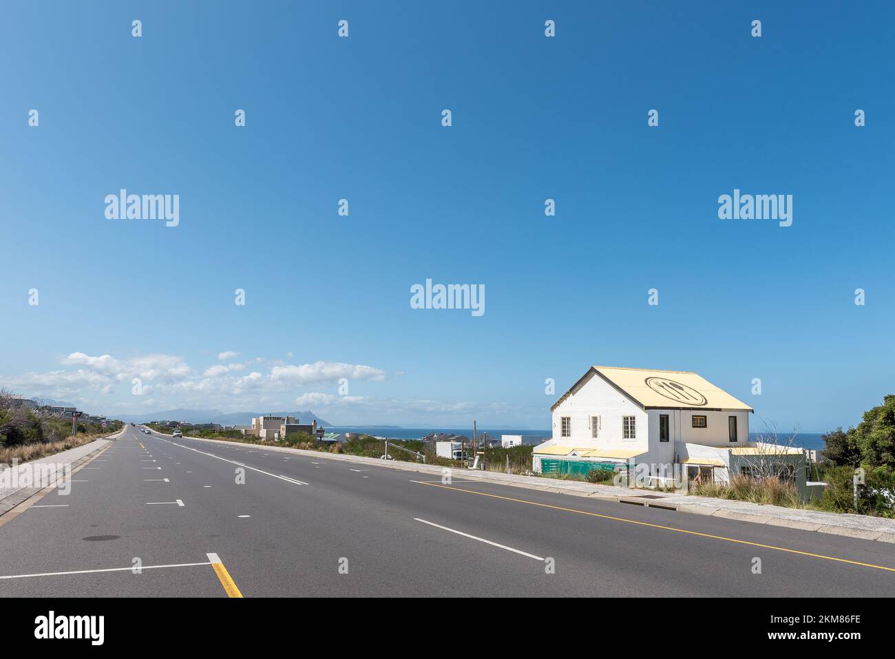 Bettys Bay, South Africa - Sep 20, 2022: A street scene, with businesses and vehicles, in Bettys Bay in the Western Cape Province Stock Photo