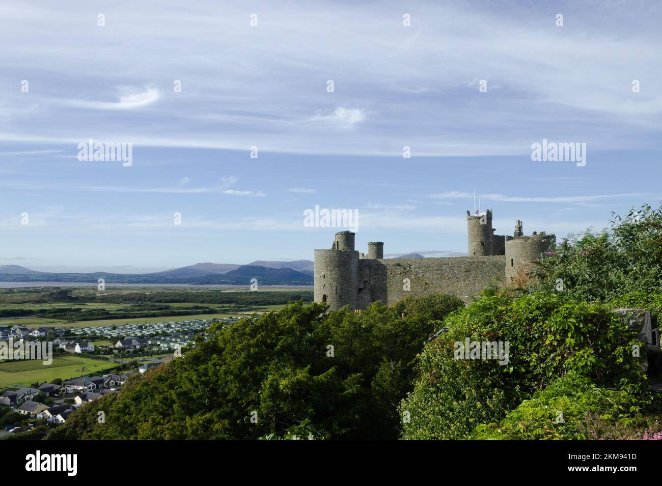 Harlech Castle, Wales. Landscape view of a UNESCO monument.   Beautiful Welsh world heritage site.  Fortification of Edward 1 of England.  Blue sky an Stock Photo