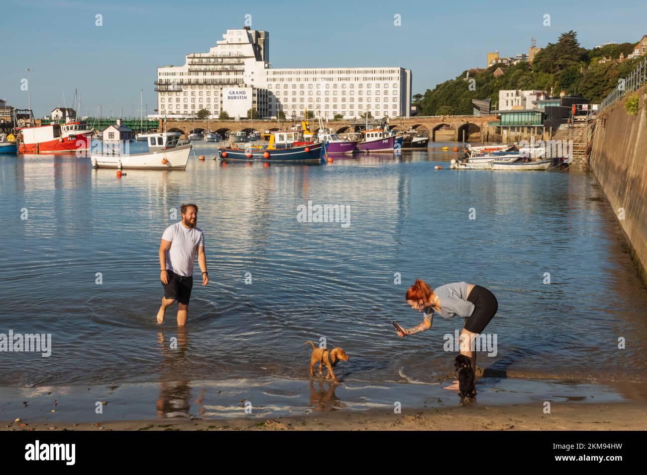 England, Kent, Folkestone, Folkestone Harbour, Couple Paddling in Water