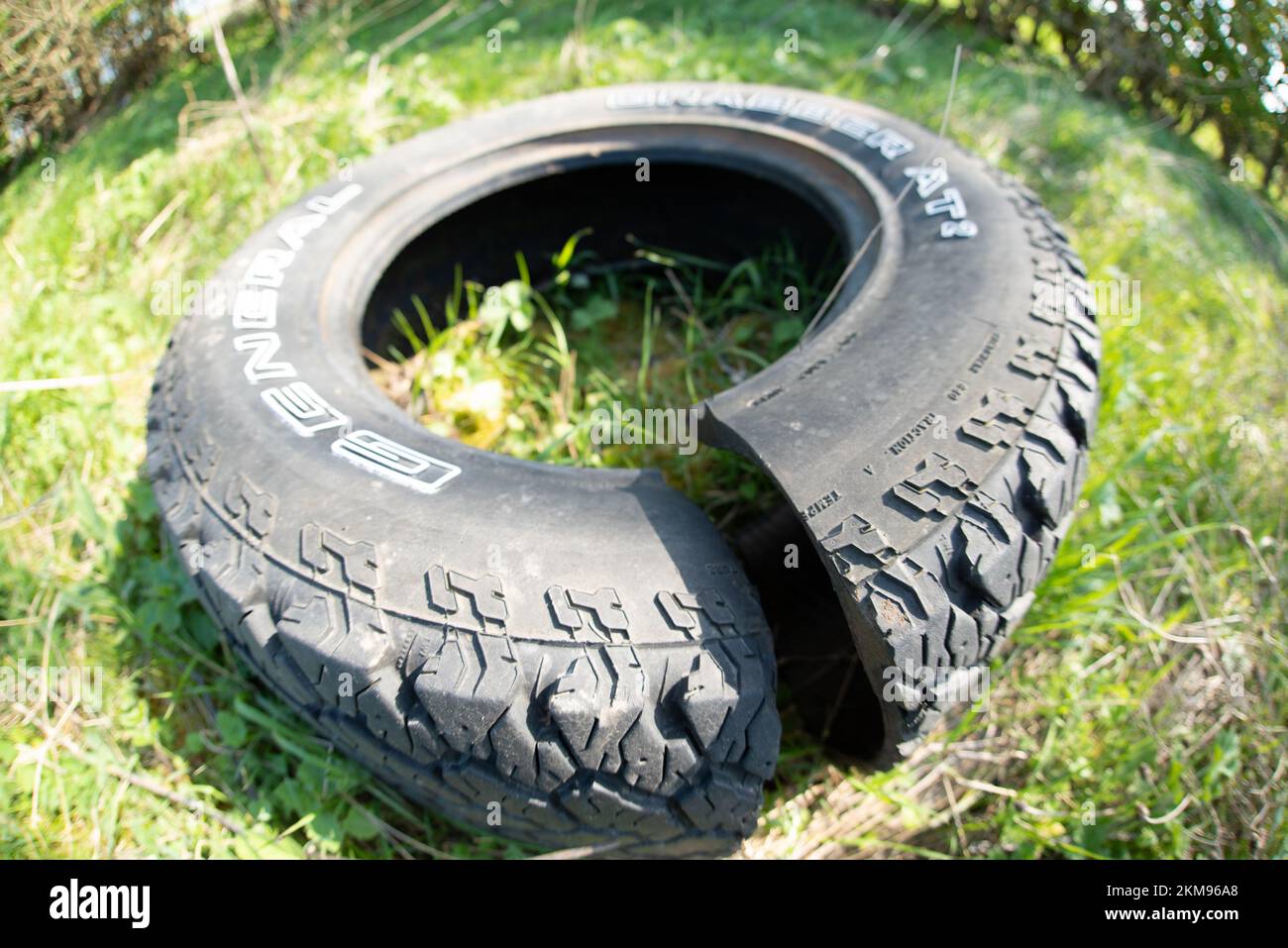 Abandoned Old Tyre UK Fly Tipping RubbishTire Stock Photo