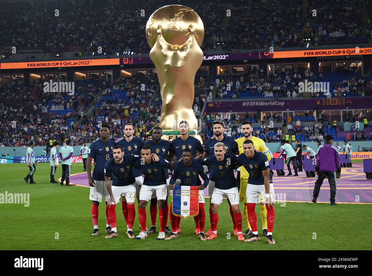 Doha, Qatar. 26th Nov, 2022. Soccer, World Cup, France - Denmark, Preliminary Round, Group D, Matchday 2, Stadium 974, the players of the French starting eleven stand together for a team photo in front of the oversized replica of the World Cup trophy before the start of the match, Aurélien Tchouameni (l-r), Theo Hernandez, Adrien Rabiot, Jules Kounde, Dayot Upamecano, Raphael Varane, Ousmane Dembele, Olivier Giroud, Antoine Griezmann, goalkeeper Hugo Lloris and Kylian Mbappe. Credit: Robert Michael/dpa/Alamy Live News Stock Photo