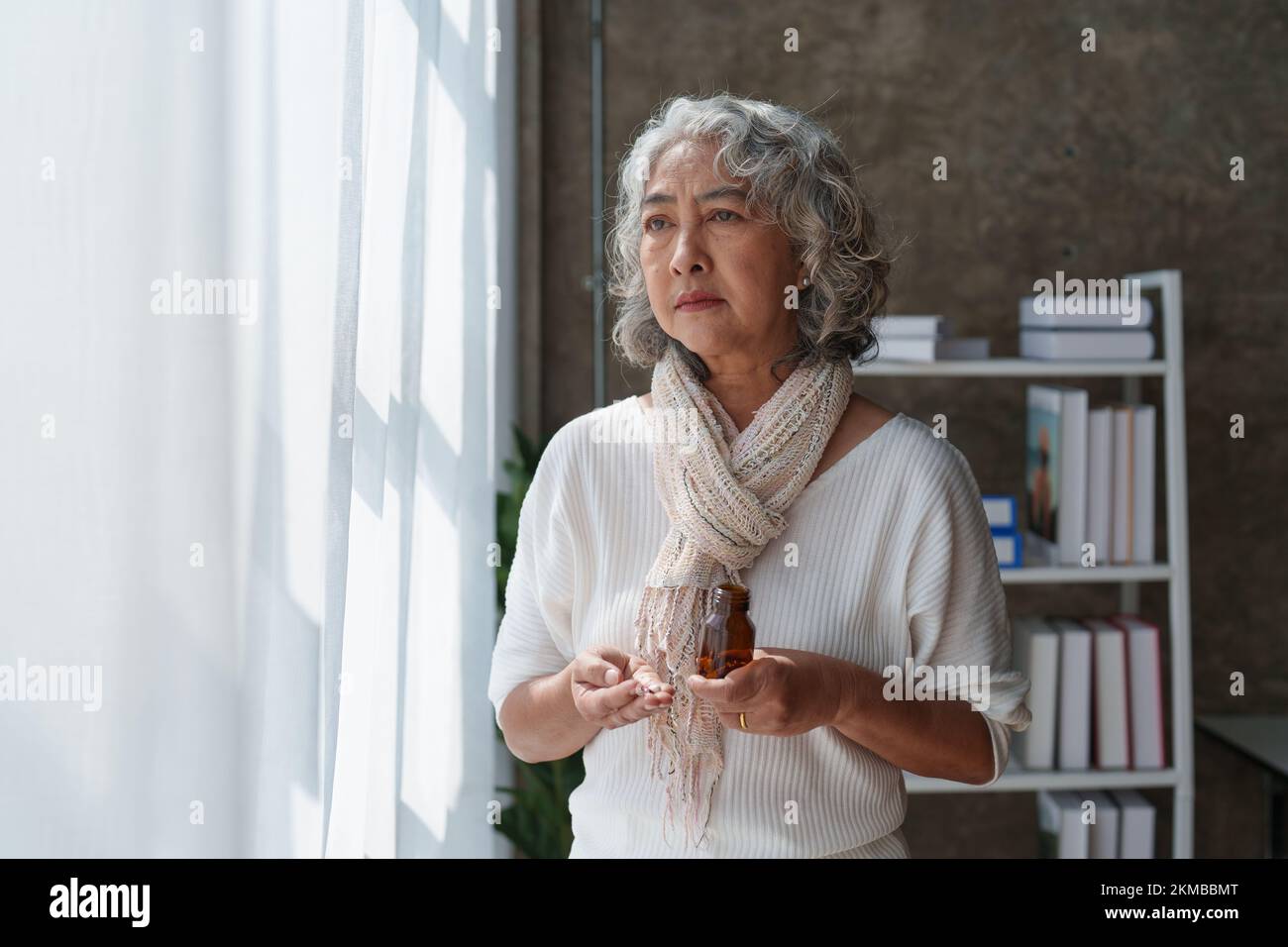 Pensive older woman lonely old senior in is home Stock Photo