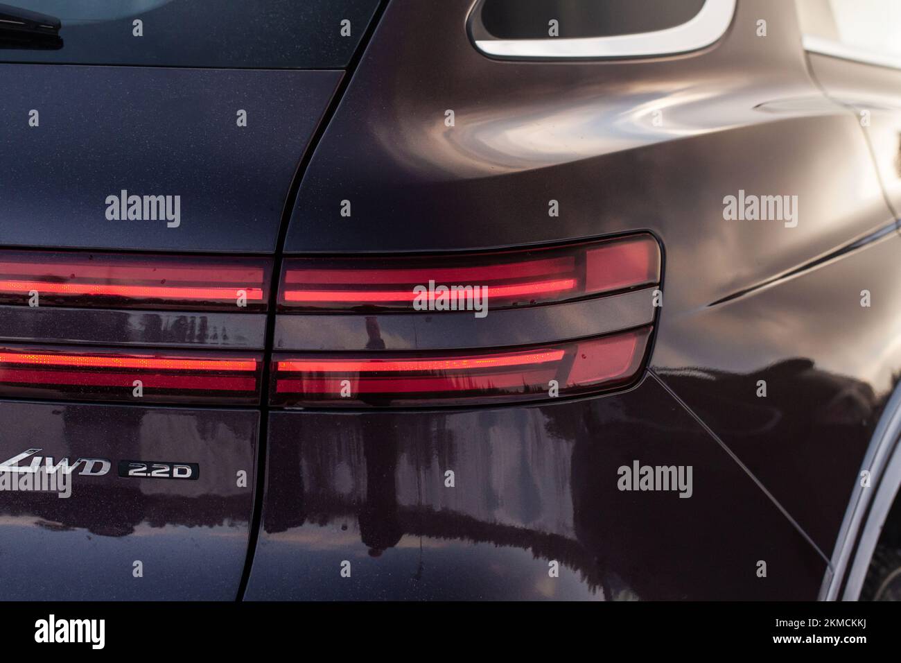 Modern rear light of a car. Brake light and arrow of large suv. Rear light of car close up view