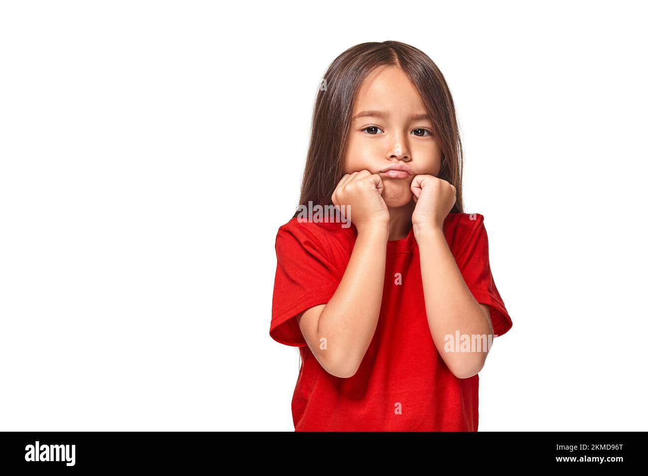 Red Offend Girl in red t-shirt serious face offended white background Stock Photo ...
