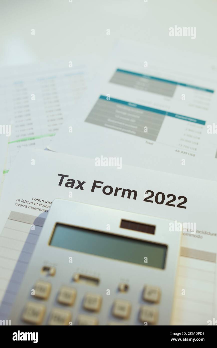 tax form 2022 and calculator at desk Stock Photo Alamy