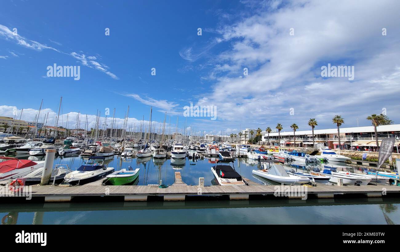The view of dense docked boats in a harbor under the blue sky Stock ...