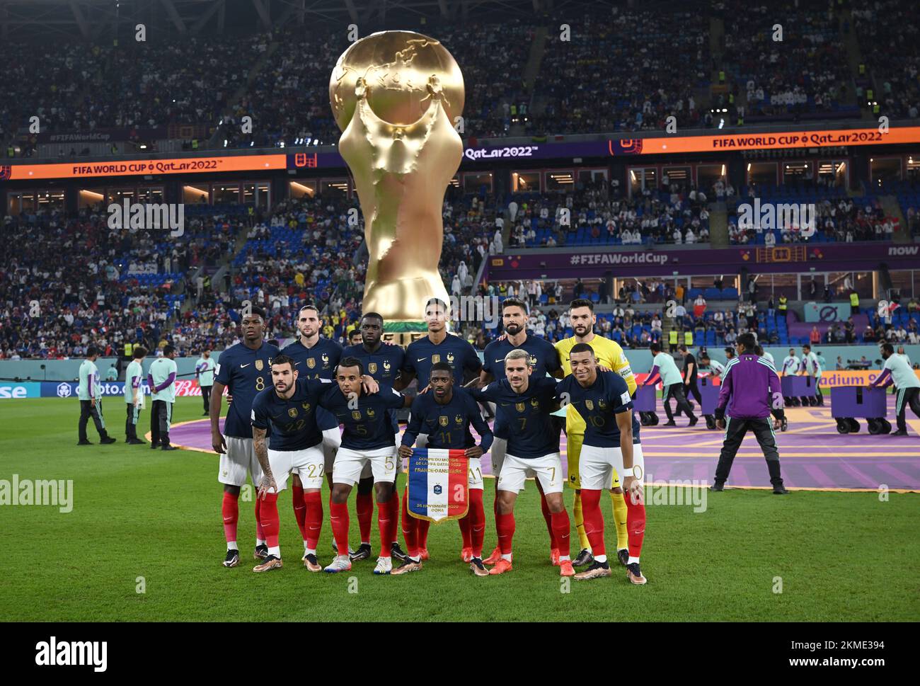 Doha, Qatar. 26th Nov, 2022. Soccer, World Cup, France - Denmark, Preliminary Round, Group D, Matchday 2, Stadium 974, the players of the French starting eleven stand together for a team photo in front of the oversized replica of the World Cup trophy before the start of the match, Aurélien Tchouameni (l-r), Theo Hernandez, Adrien Rabiot, Jules Kounde, Dayot Upamecano, Raphael Varane, Ousmane Dembele, Olivier Giroud, Antoine Griezmann, goalkeeper Hugo Lloris and Kylian Mbappe. Credit: Robert Michael/dpa/Alamy Live News Stock Photo