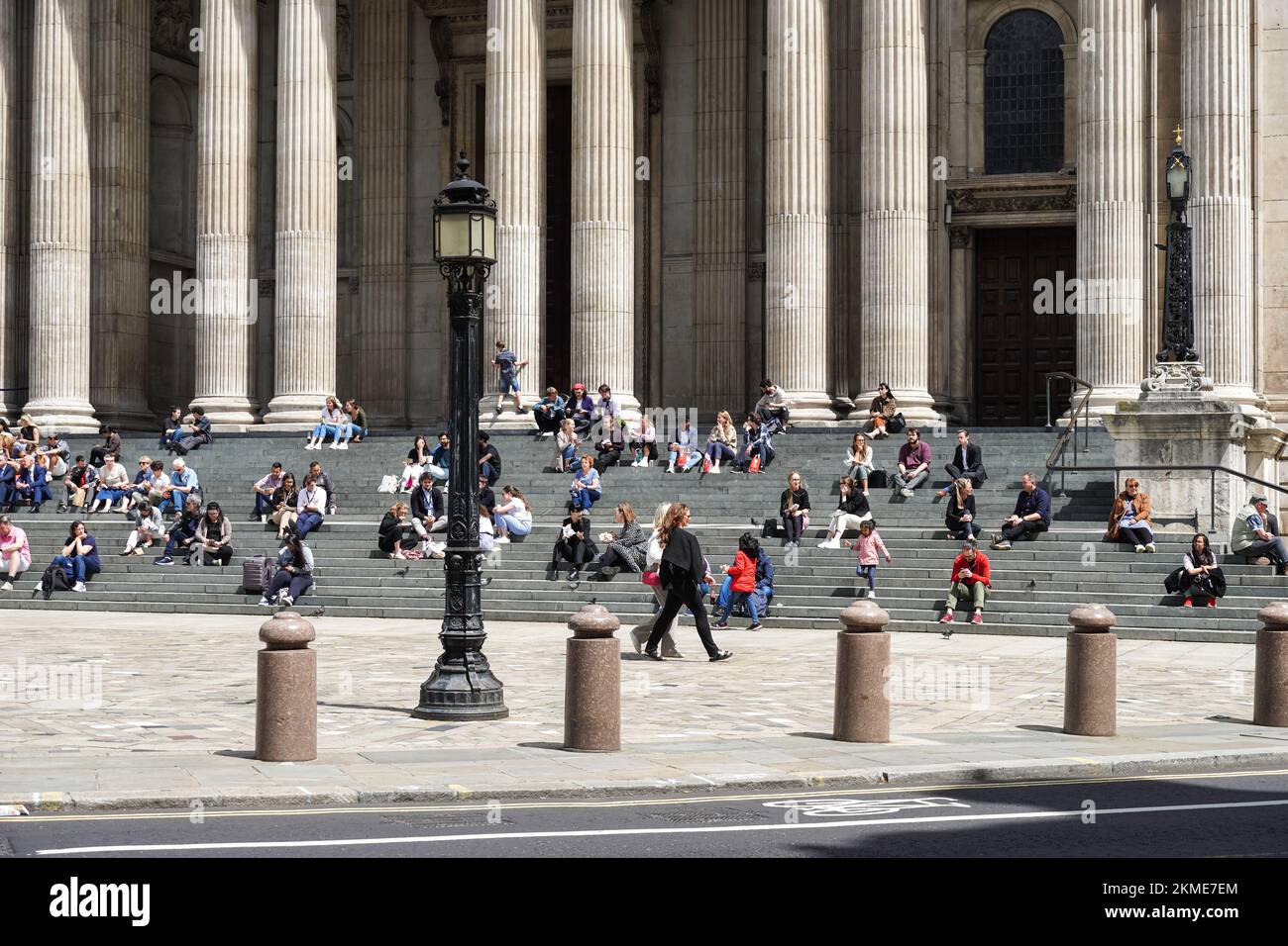 People enjoying sunny day in front of St Paul's Cathedral in London, England United Kingdom UK Stock Photo