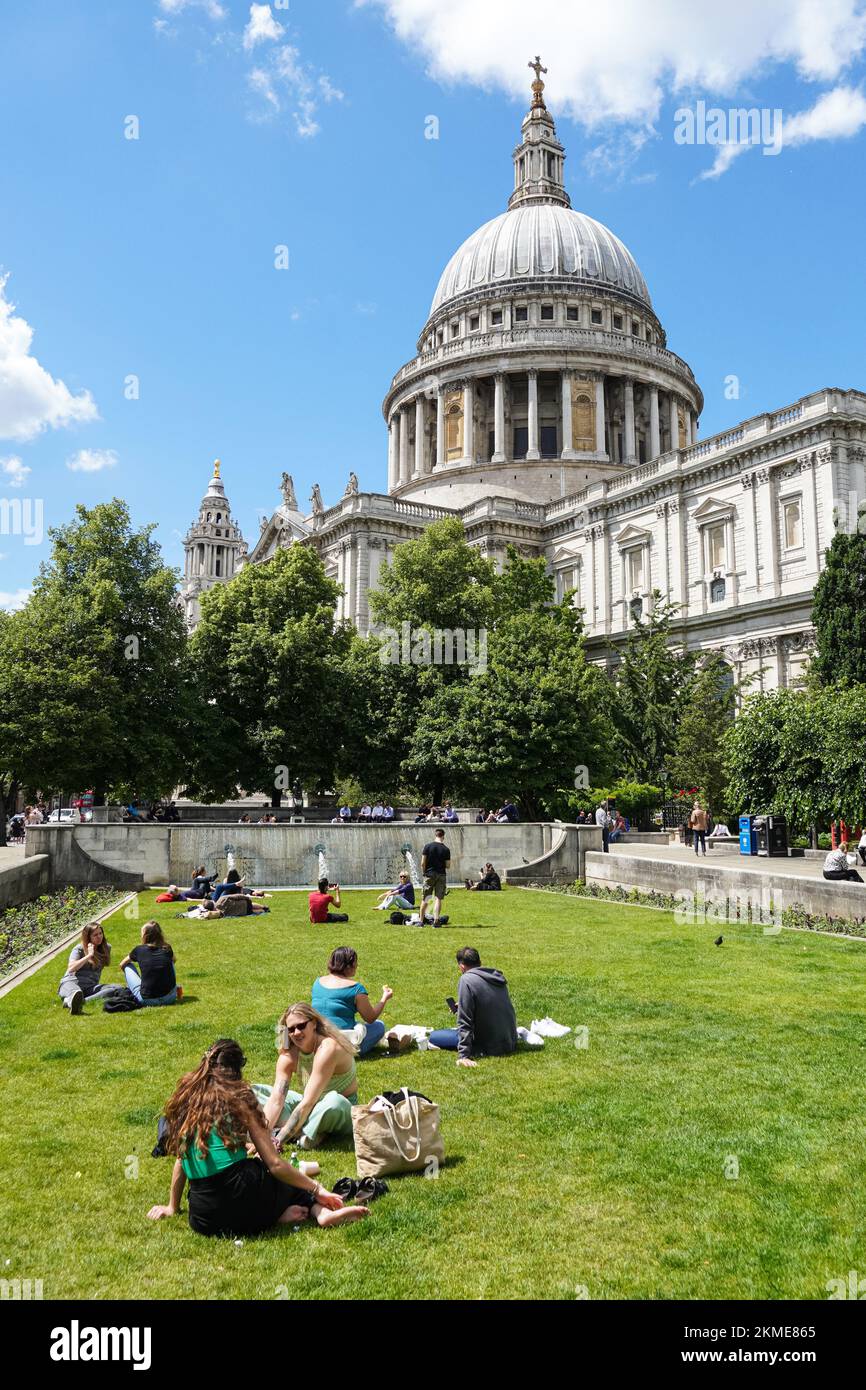 People enjoying sunny day in front of St Paul's Cathedral in London, England United Kingdom UK Stock Photo