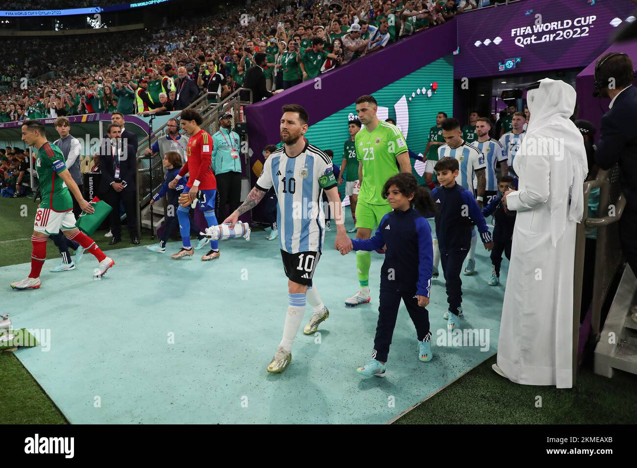 Lusail Iconic Stadium, Lusail, Qatar. 26th Nov, 2022. FIFA World Cup Football, Argentina versus Mexico; Lionel Messi of Argentina alongside Andres Guardado of Mexico walking onto the pitch from the tunnel Credit: Action Plus Sports/Alamy Live News Stock Photo