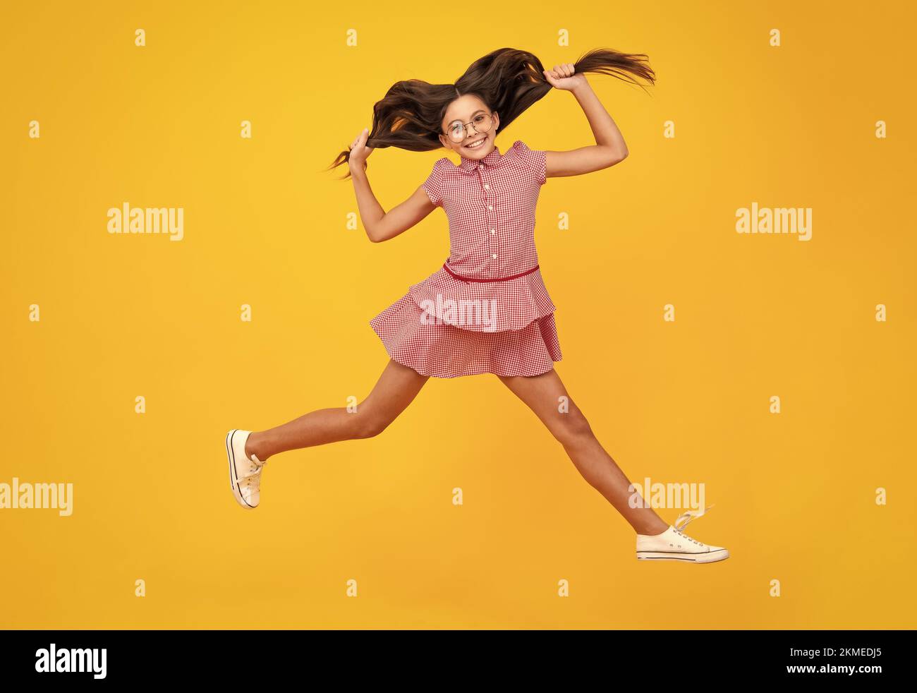 Happiness, activity and child. Teenager girl jumping on isolated