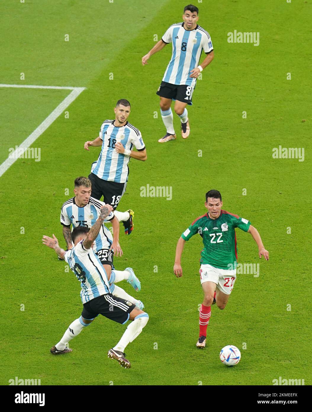 Mexico's Hirving Lozano takes on the Argentina defence during the FIFA