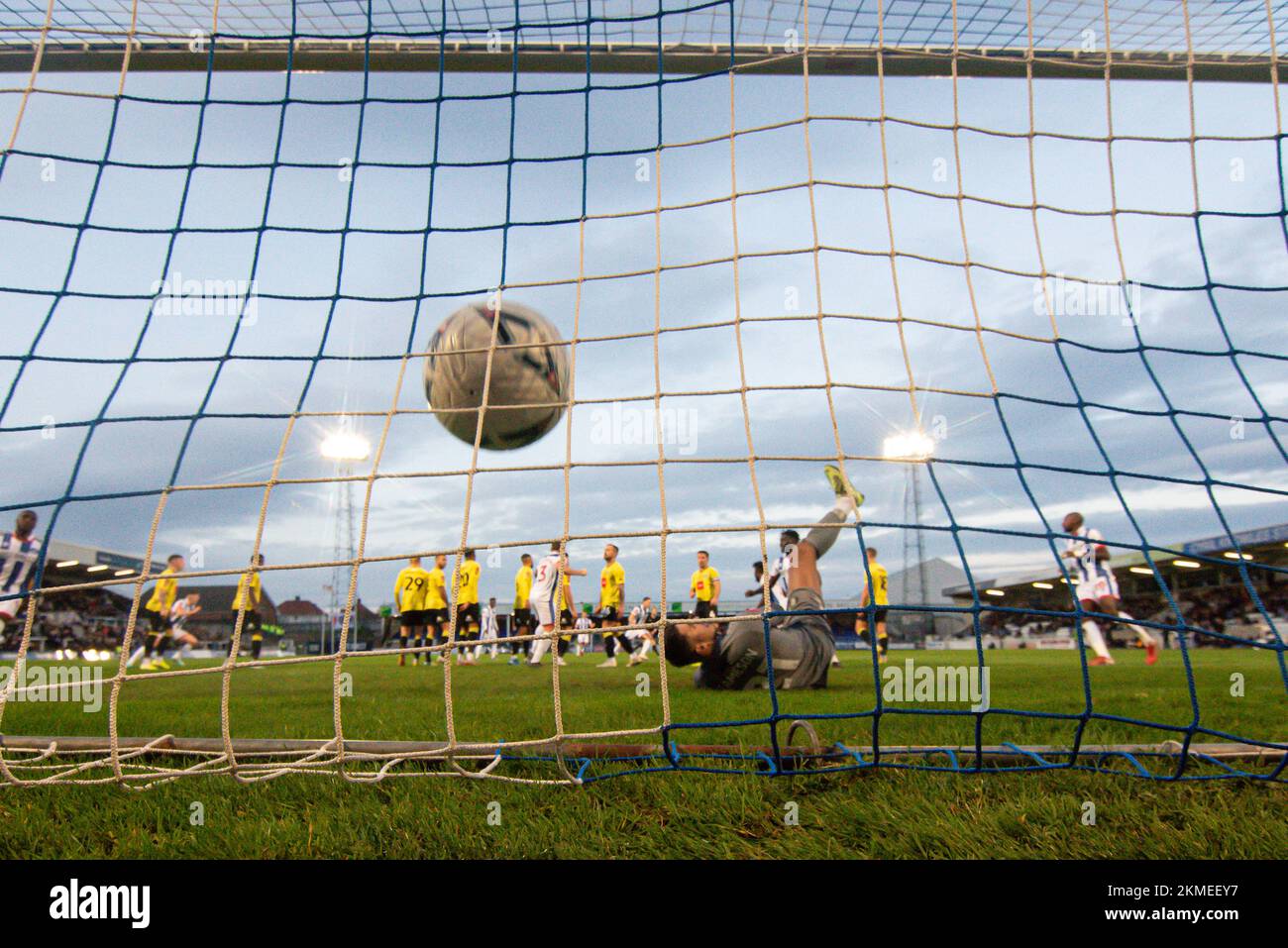 Hartlepool, UK. 19th Nov, 2022. Hartlepool United's Callum Cooke free kicks is too hot to handle for Harrogate Town's Pete Jameson during the FA Cup Second Round match between Hartlepool United and Harrogate Town at Victoria Park, Hartlepool on Saturday 26th November 2022. (Credit: Scott Llewellyn | MI News) Credit: MI News & Sport /Alamy Live News Stock Photo