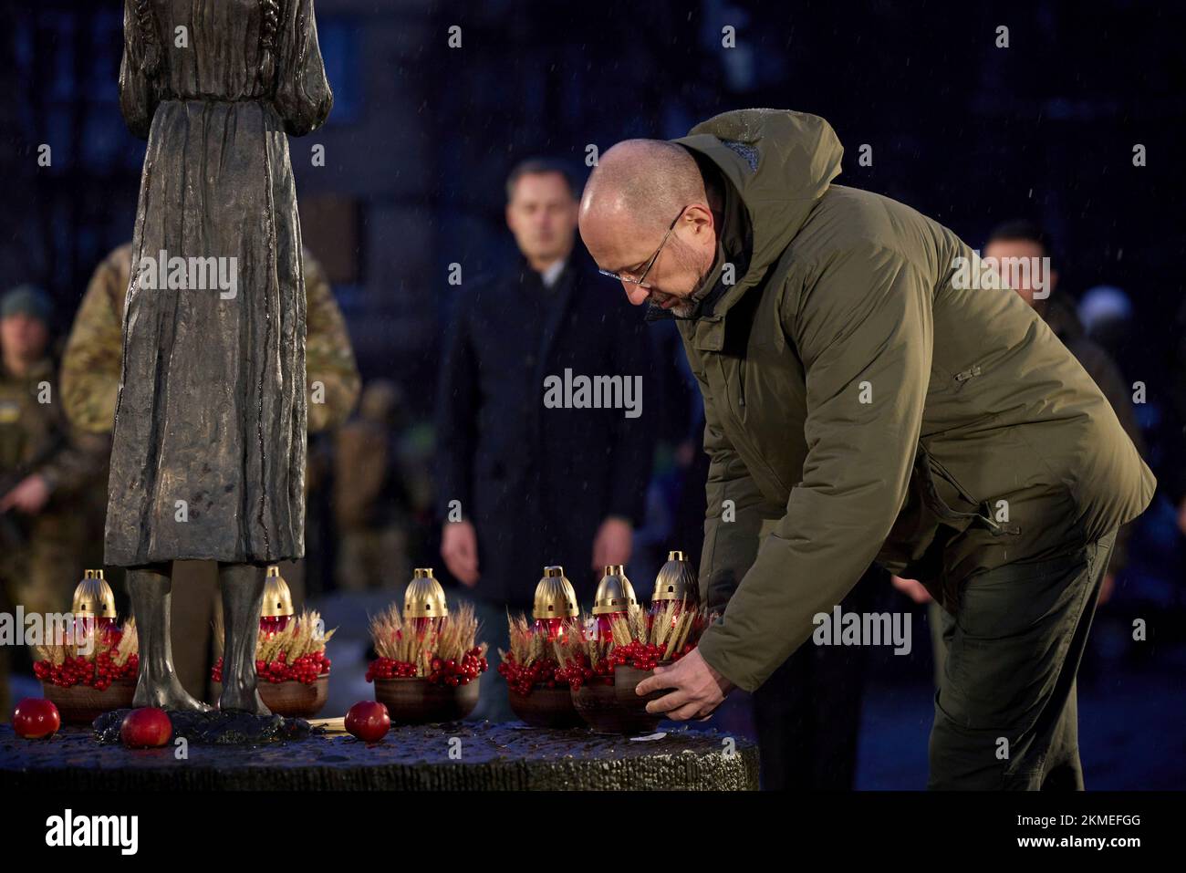 Kyiv, Ukraine. 26th Nov, 2022. Ukrainian Prime Minister Denys Shmyhal places a lantern at the Bitter Memory of Childhood statue in honor of the 90th anniversary of the Holodomor famine, November 26, 2022 in Kyiv, Ukraine. Credit: Ukraine Presidency/Ukrainian Presidential Press Office/Alamy Live News Stock Photo