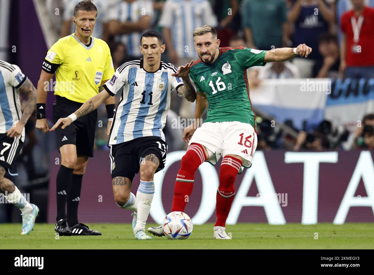 LUSAIL CITY - (lr)Referee Daniele Orsato, Angel Di Maria of Argentina, Hector Herrera of Mexico during the FIFA World Cup Qatar 2022 group C match between Argentina and Mexico at Lusail Stadium on November 26, 2022 in Lusail City, Qatar. AP | Dutch Height | MAURICE OF STONE Stock Photo
