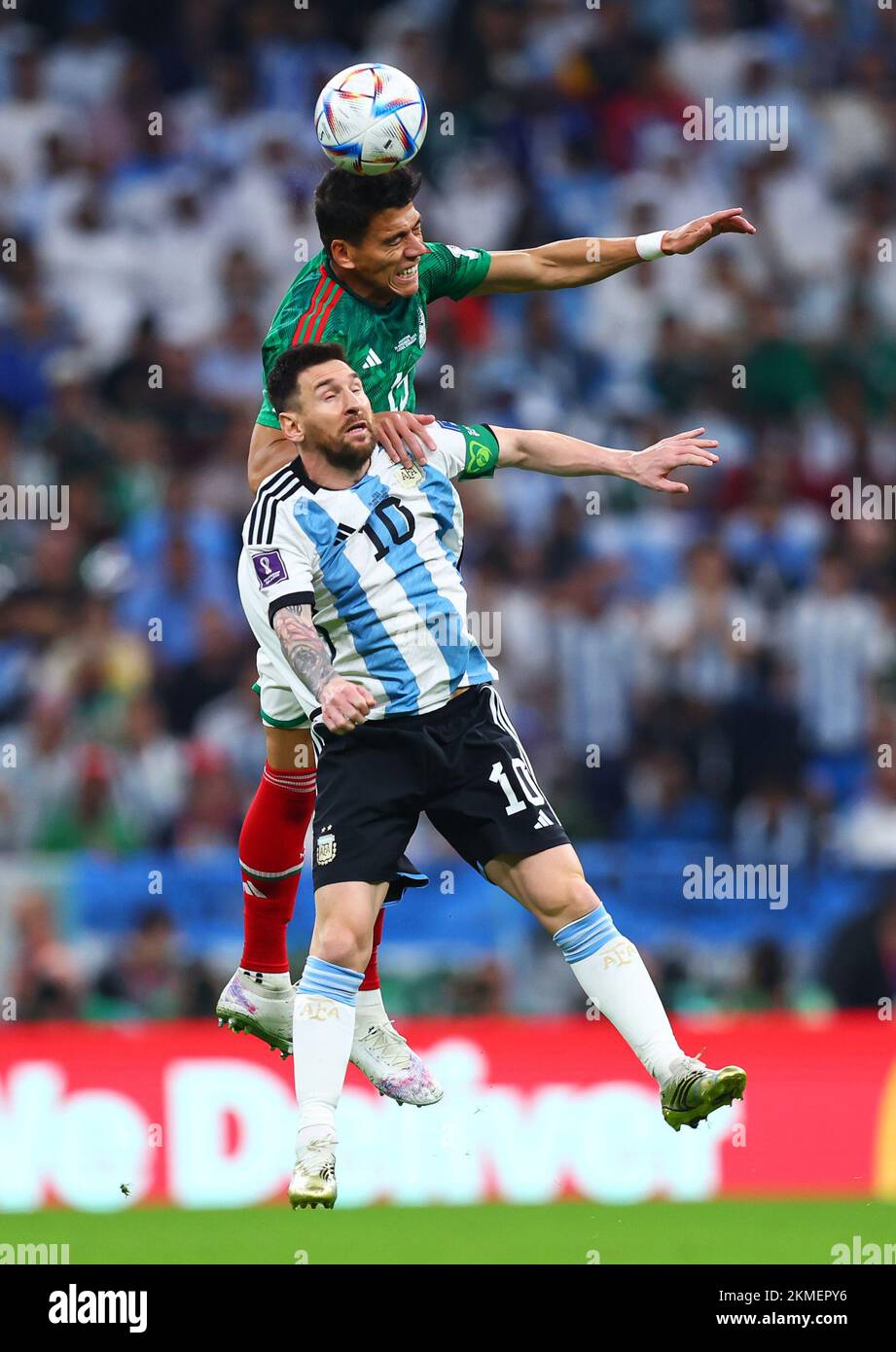 Lusail, Qatar. 26th Nov, 2022. Soccer, World Cup, Argentina - Mexico, Preliminary round, Group C, Matchday 2, Lusail Iconic Stadium, Lionel Messi (l) of Argentina against Hector Moreno (r) of Mexico in a header duel. Credit: Tom Weller/dpa/Alamy Live News Stock Photo