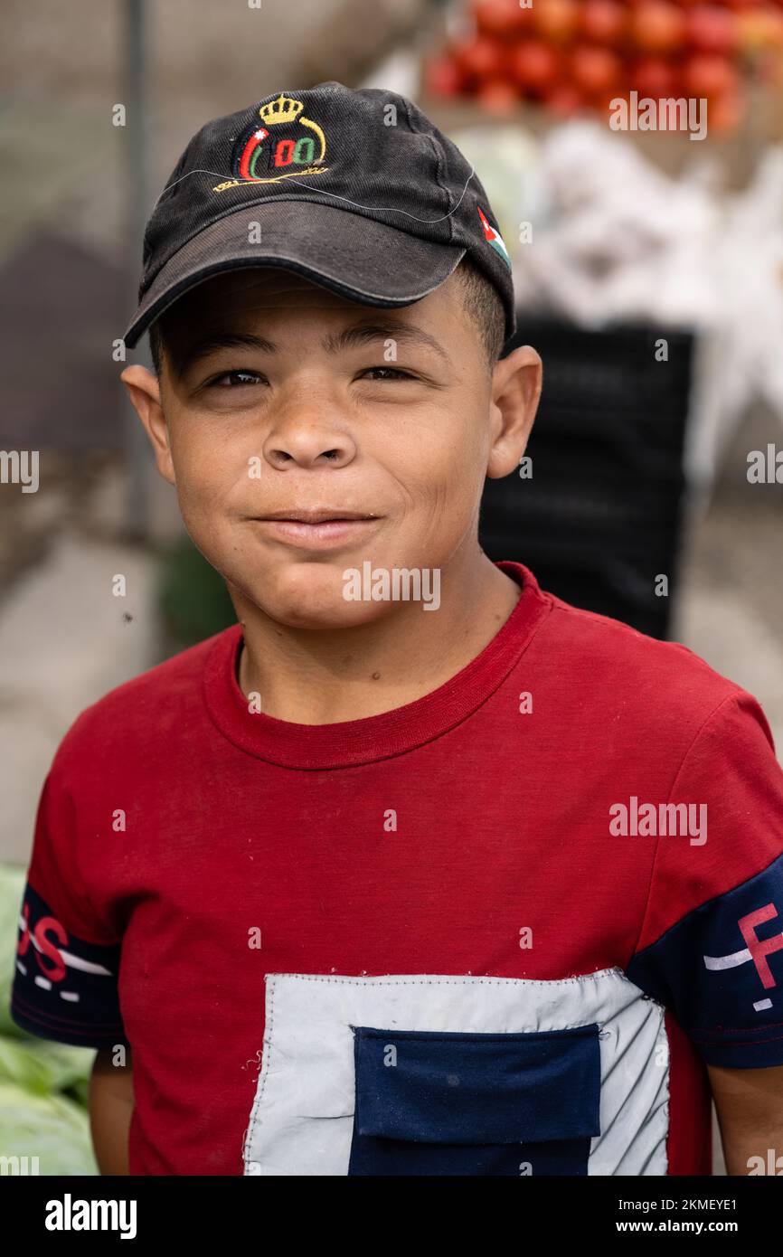 Dayr Allah, Jordan - October 25 2022: Boy at the local Farmers Market Stock Photo