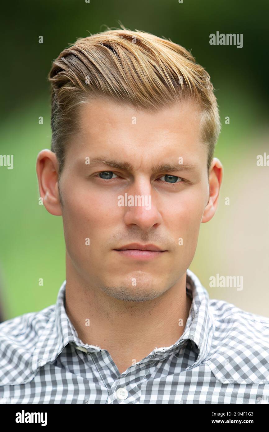 Portrait of a handsome blond young man Stock Photo - Alamy