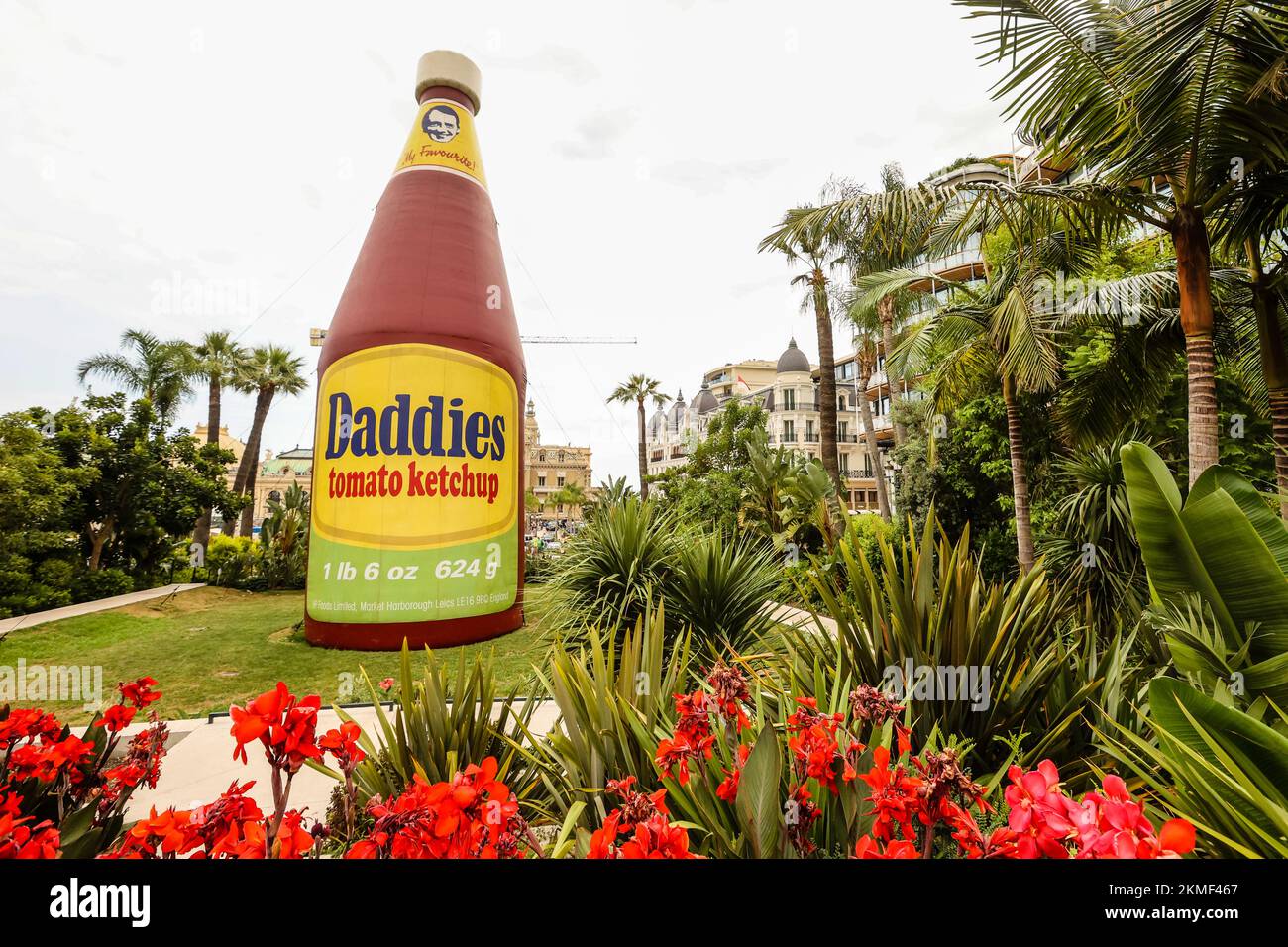 A huge bottle of Daddies tomato ketchup in the Casino Gardens,a work of, art,Daddies Tomato Ketchup Inflatable,sculpture,by, artist, Paul McCarthy. It is part of a bigger exhibition that features many of the artist’s works in a retrospective of his art in the heart of the Principality, Monte Carlo,Monaco,South of France,France,French,Europe,European,August,summer.Mediterranean,coast,city,state,country,rich,millionaires, Stock Photo