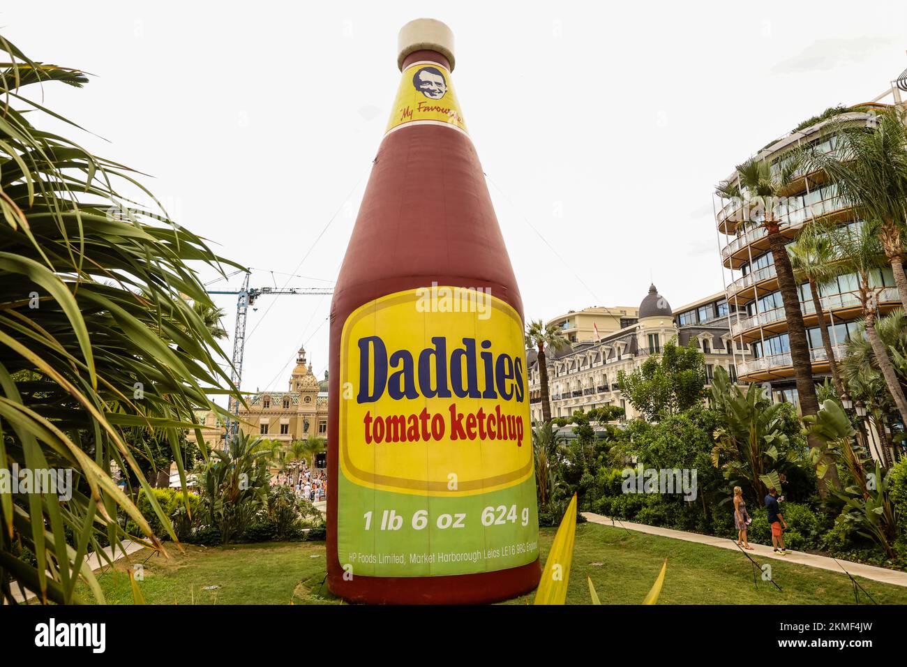 A huge bottle of Daddies tomato ketchup in the Casino Gardens,a work of, art,Daddies Tomato Ketchup Inflatable,sculpture,by, artist, Paul McCarthy. It is part of a bigger exhibition that features many of the artist’s works in a retrospective of his art in the heart of the Principality, Monte Carlo,Monaco,South of France,France,French,Europe,European,August,summer.Mediterranean,coast,city,state,country,rich,millionaires, Stock Photo