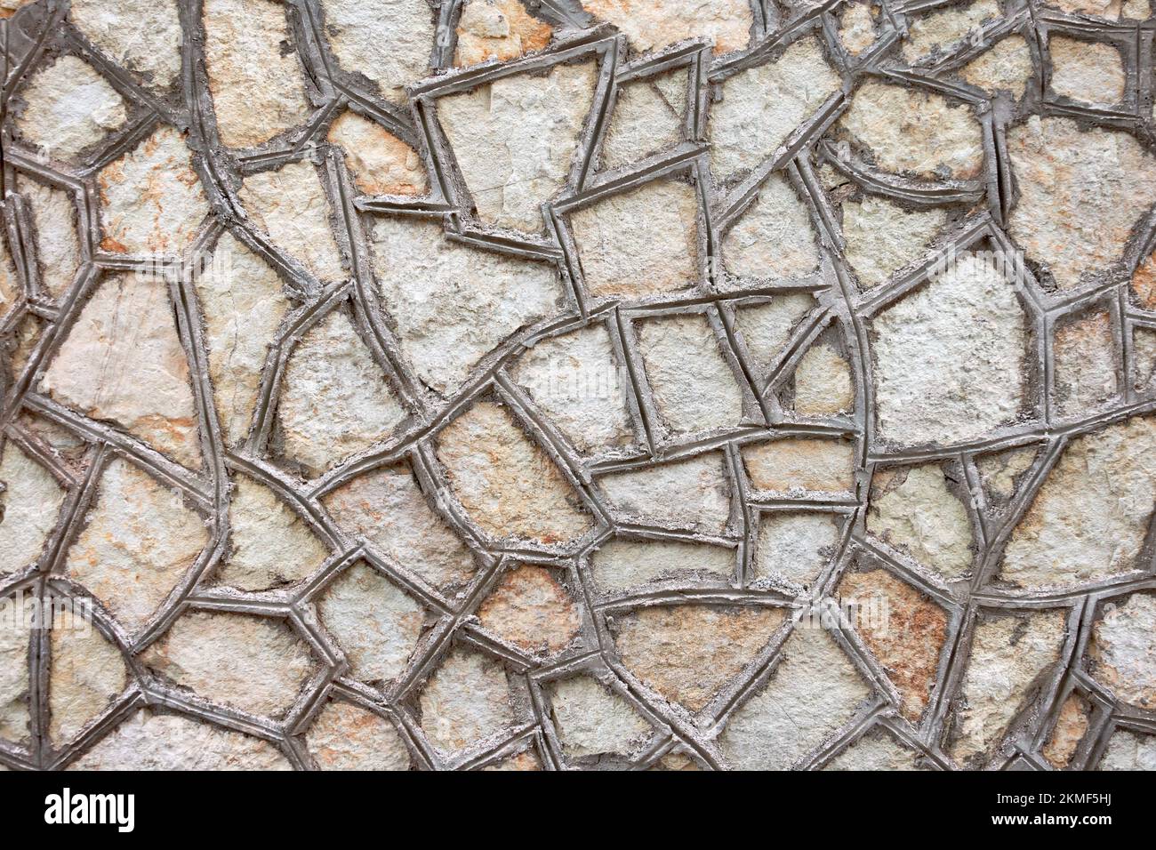The texture of the triangular tiles bonded with cement on the wall ...