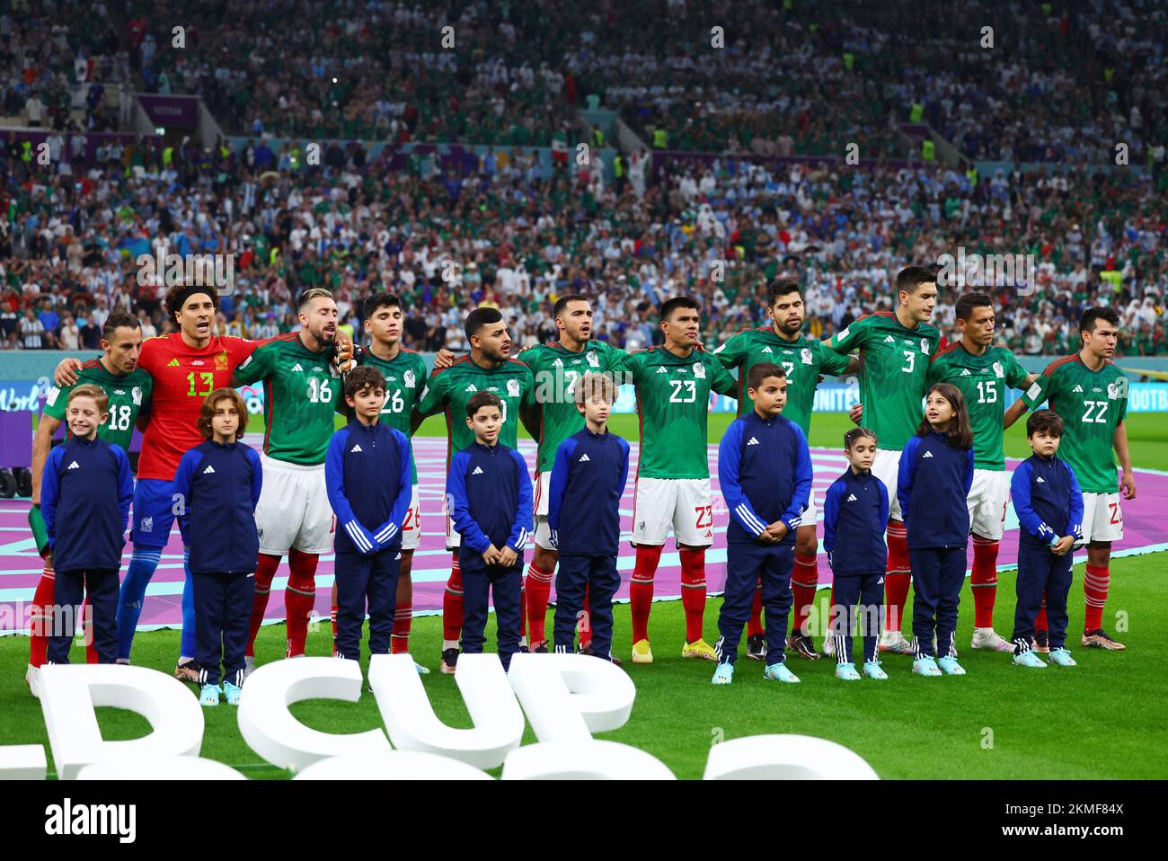 Lusail, Qatar. 26th Nov, 2022. Soccer, World Cup, Argentina - Mexico, Preliminary Round, Group C, Matchday 2, Lusail Iconic Stadium, the players of Mexico's starting eleven stand next to each other during the national anthem, Andrés Guardado (l-r), goalkeeper Guillermo Ochoa, Kevin Alvarez, Alexis Vega, Luis Chavez, Jesus Gallardo, Nestor Araujo, Cesar Montes, Hector Moreno and Hirving Lozano. Credit: Tom Weller/dpa/Alamy Live News Stock Photo