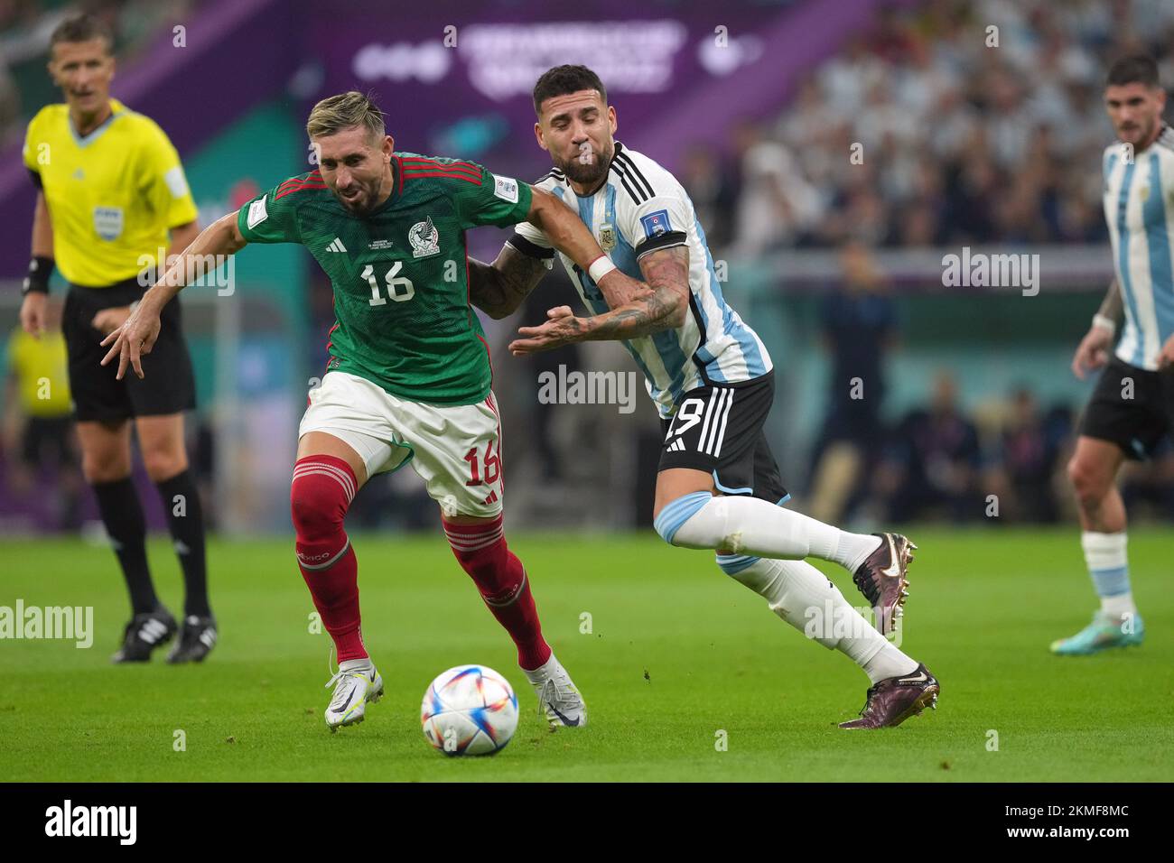 Mexico's Hector Herrera and Argentina's Nicolas Otamendi (left) battle for the ball during the FIFA World Cup Group C match at the Lusail Stadium in Lusail, Qatar. Picture date: Saturday November 26, 2022. Stock Photo