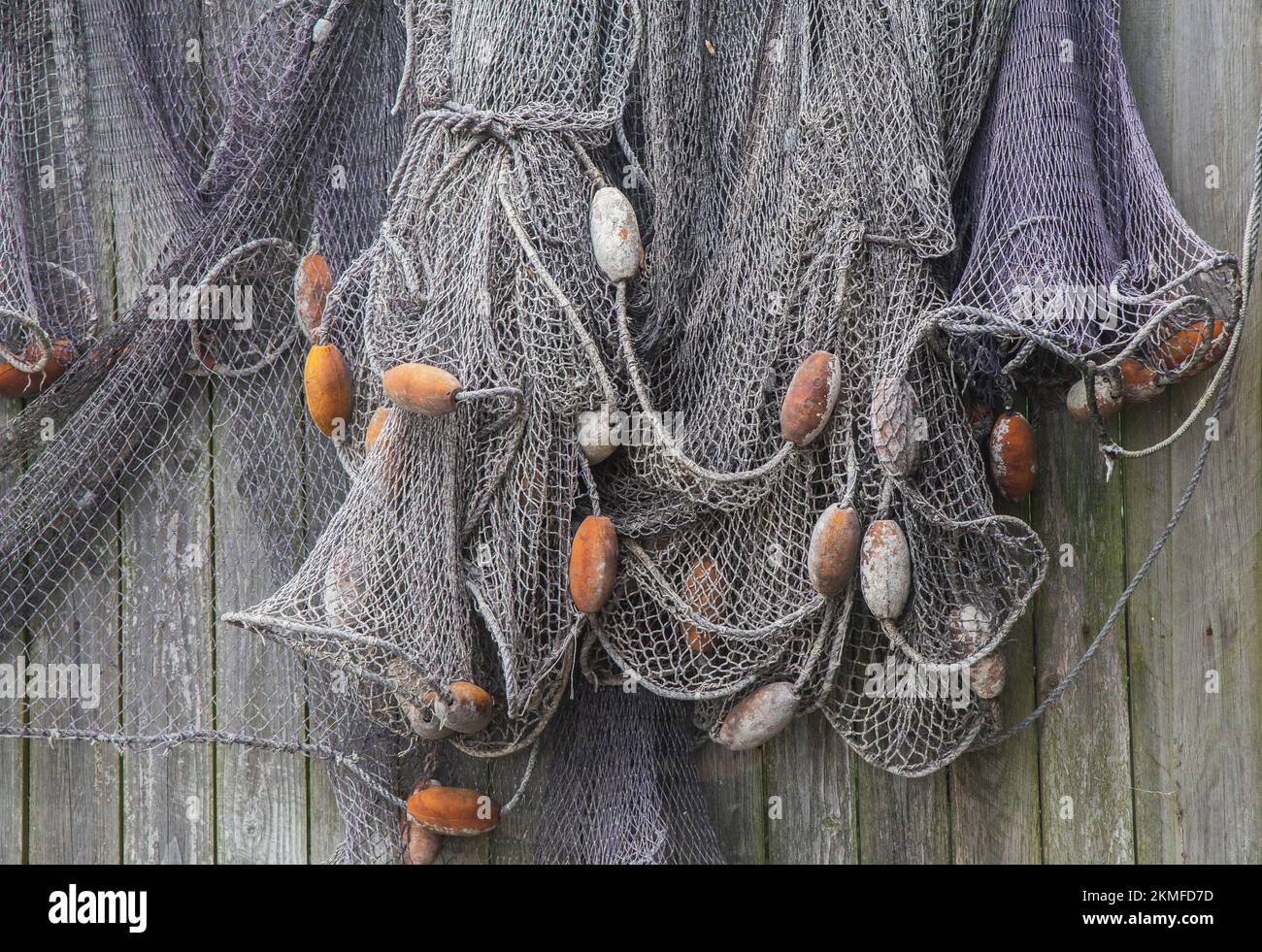 Old fishing net on a wooden fence. Background Stock Photo Alamy