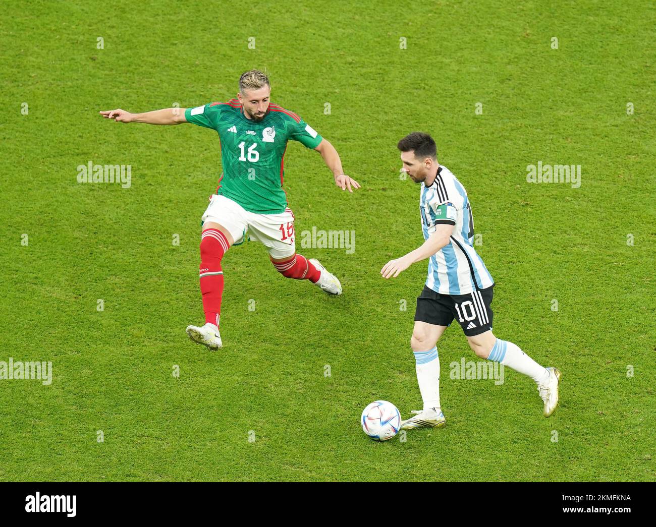Mexico's Hector Herrera (left) and Argentina's Lionel Messi during the FIFA World Cup Group C match at the Lusail Stadium in Lusail, Qatar. Picture date: Saturday November 26, 2022. Stock Photo