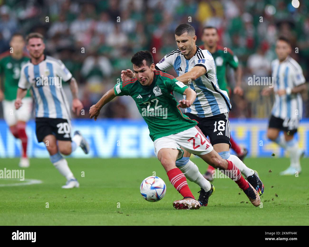 Lusail, Qatar. 26th Nov, 2022. Hirving Lozano (L, front) of Mexico vies